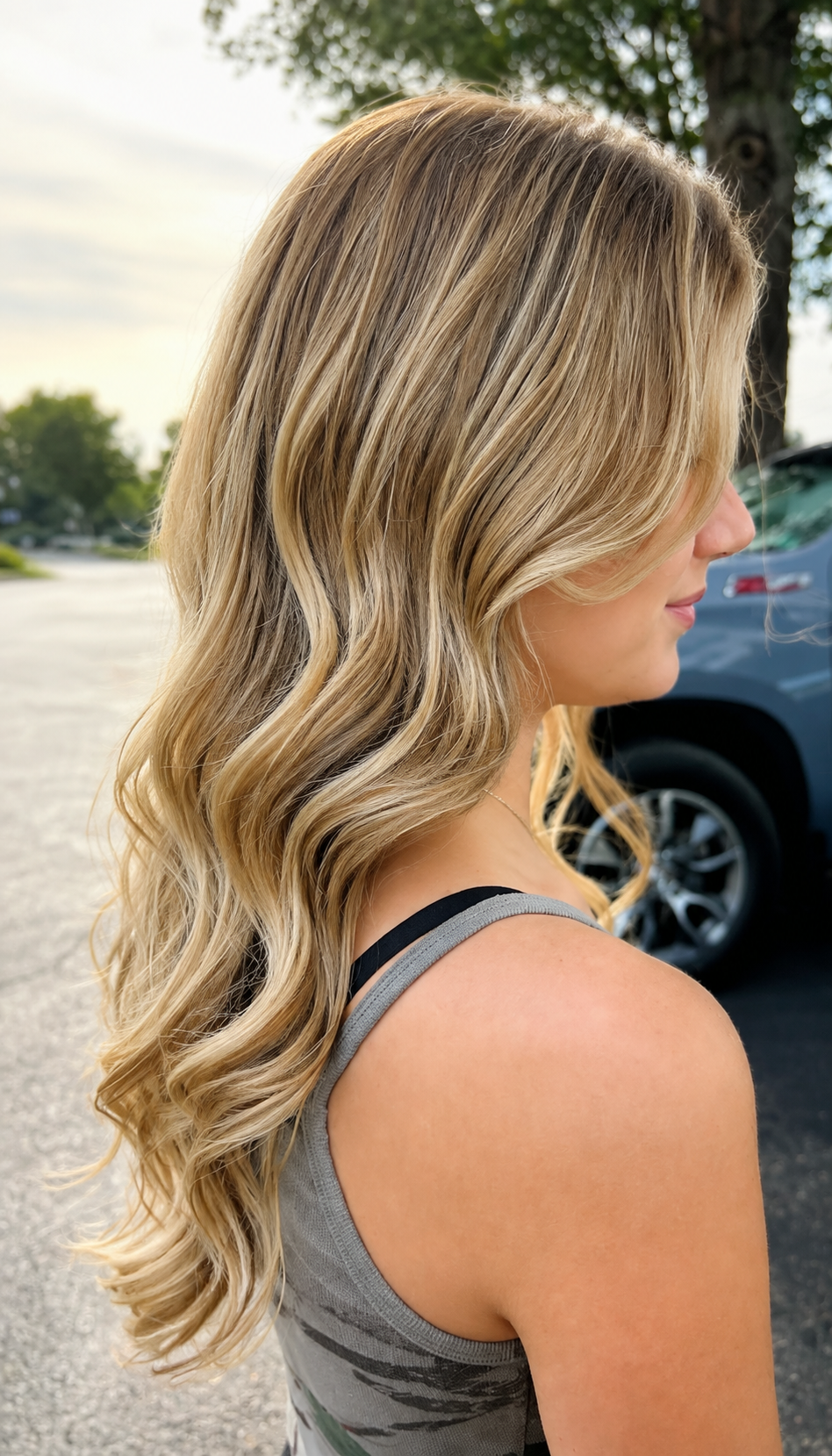 Sunlit blonde balayage with long waves
